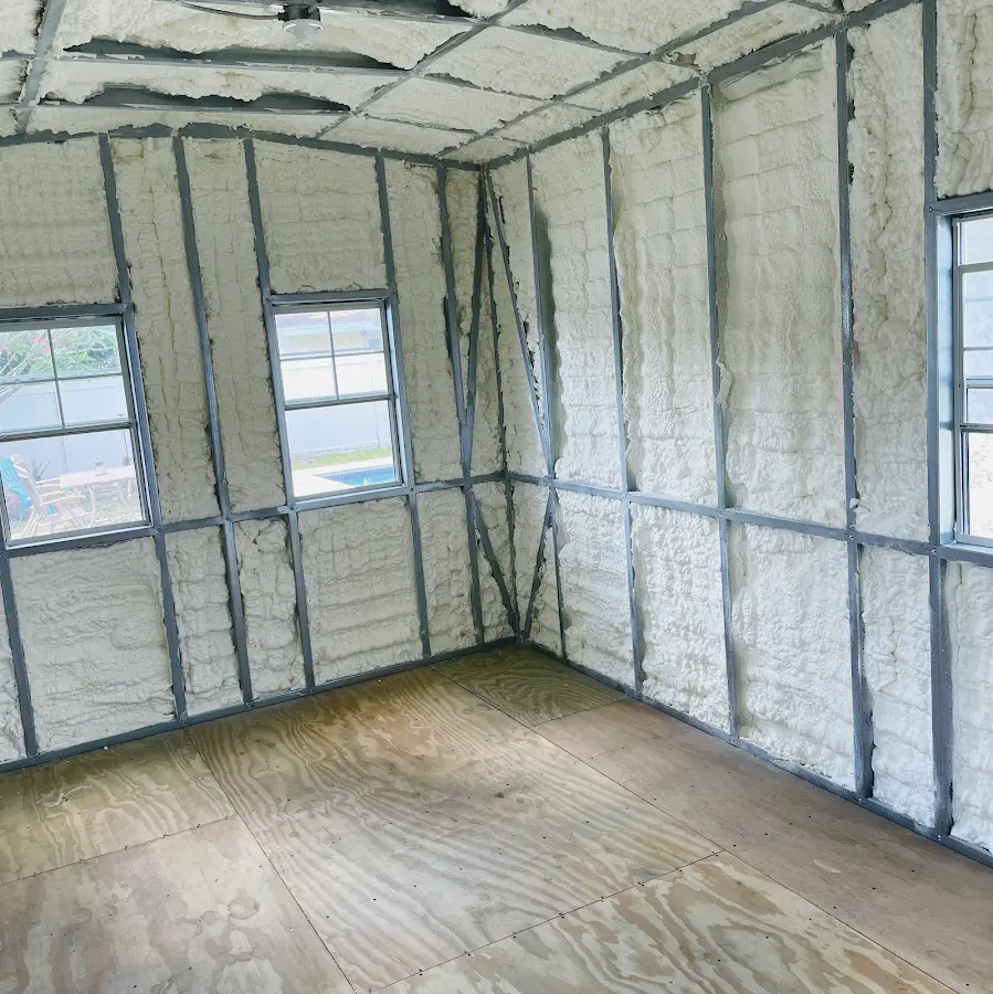 Closed-cell spray foam insulation applied to wall cavities in a residential project in Olathe